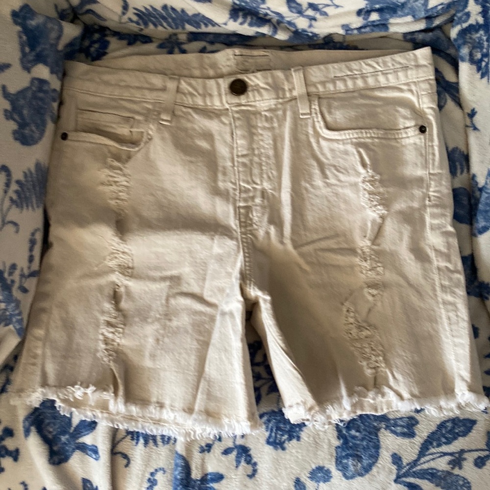 White jean shorts, down to thighs! Frilled at ends and ripped legs and pockets
